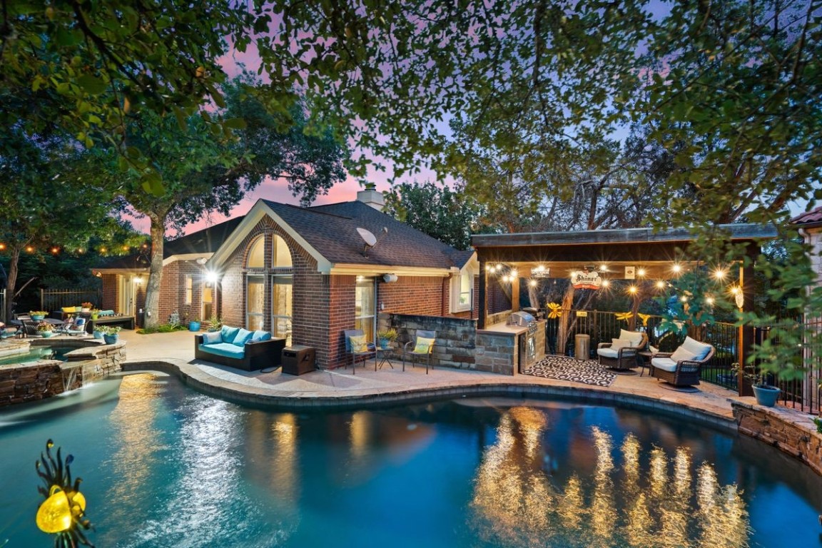 Enjoy unparalleled privacy in the backyard, where majestic live oaks provide a natural canopy and tranquil ambiance.