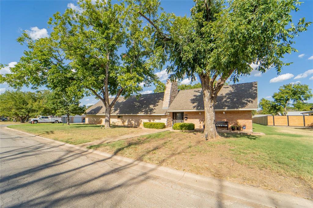 Curbside view from Harding Street-Classic Mid-Century Modern located on a large corner lot!