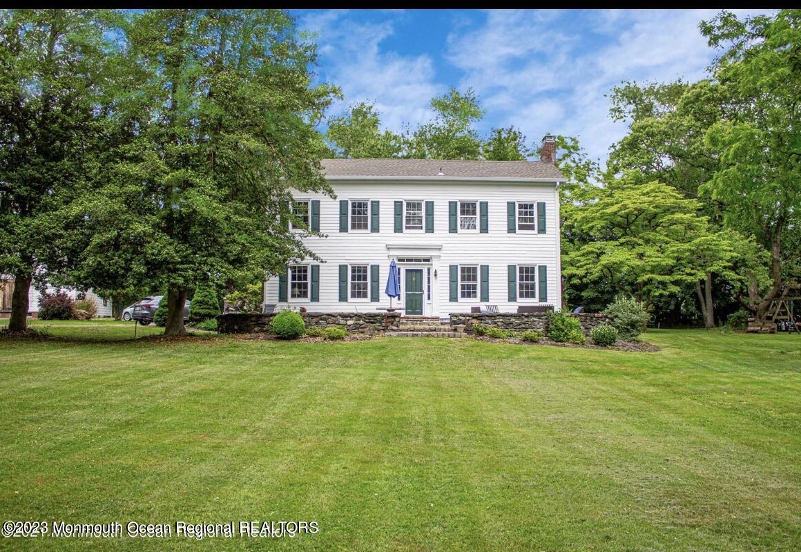 a view of a house with a big yard