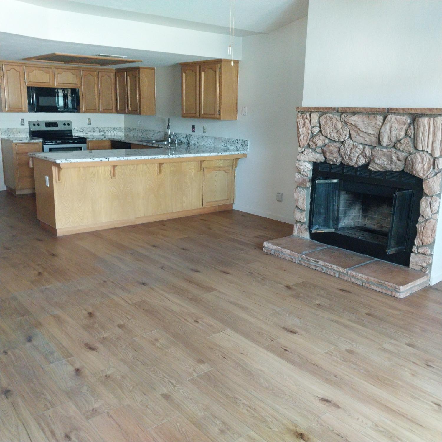 a kitchen with a stove and a fireplace