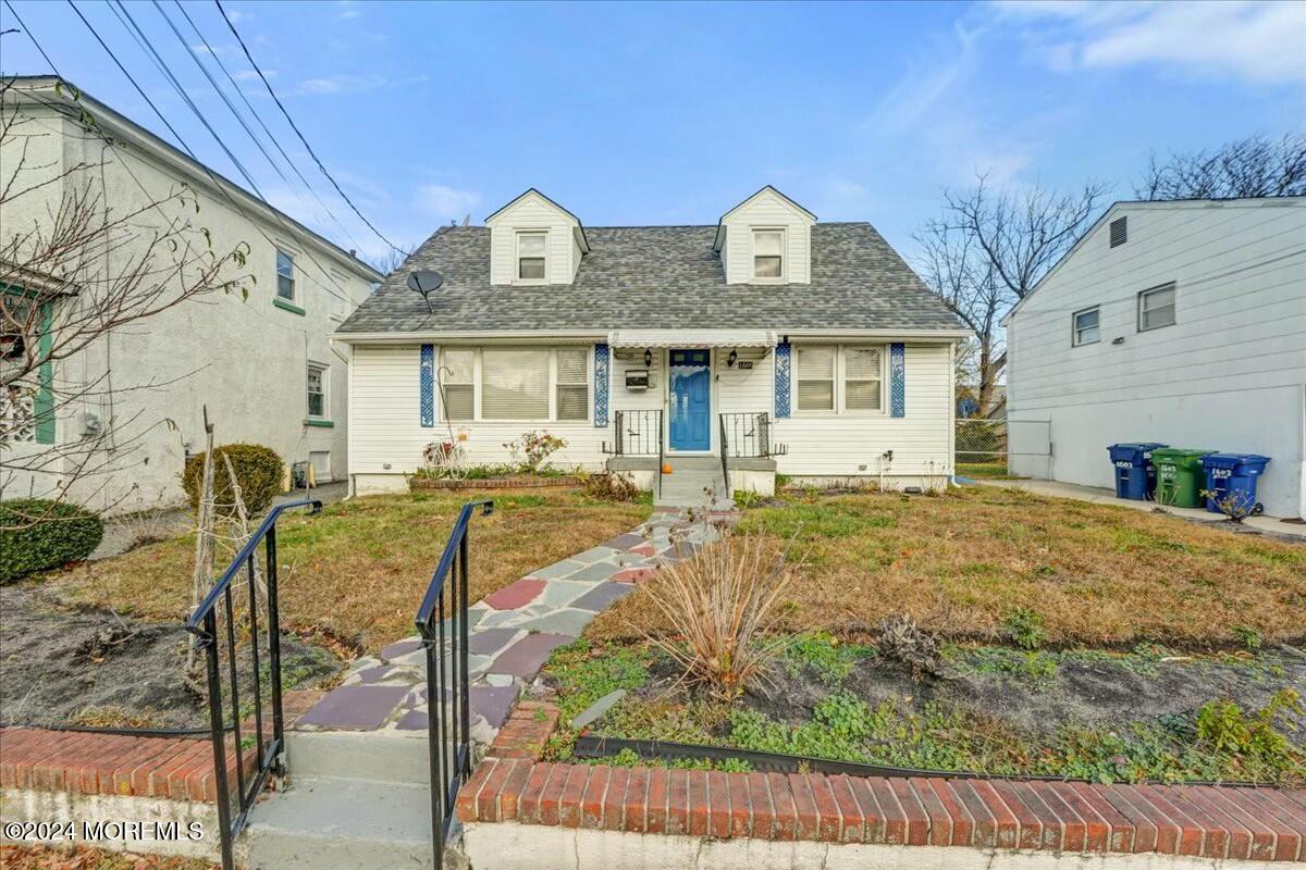 a front view of house with yard and seating area