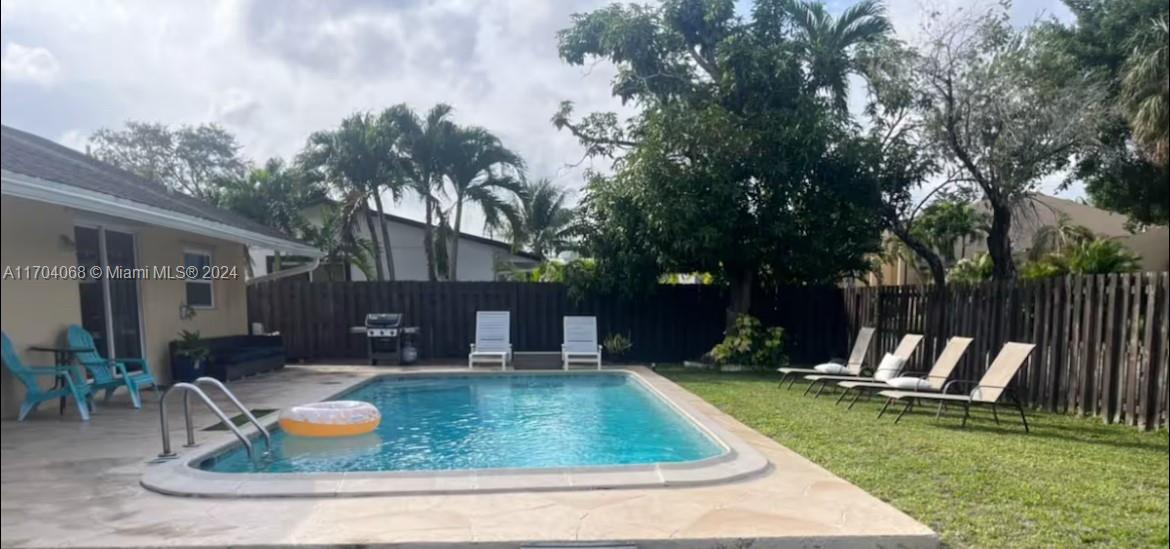 swimming pool with outdoor seating