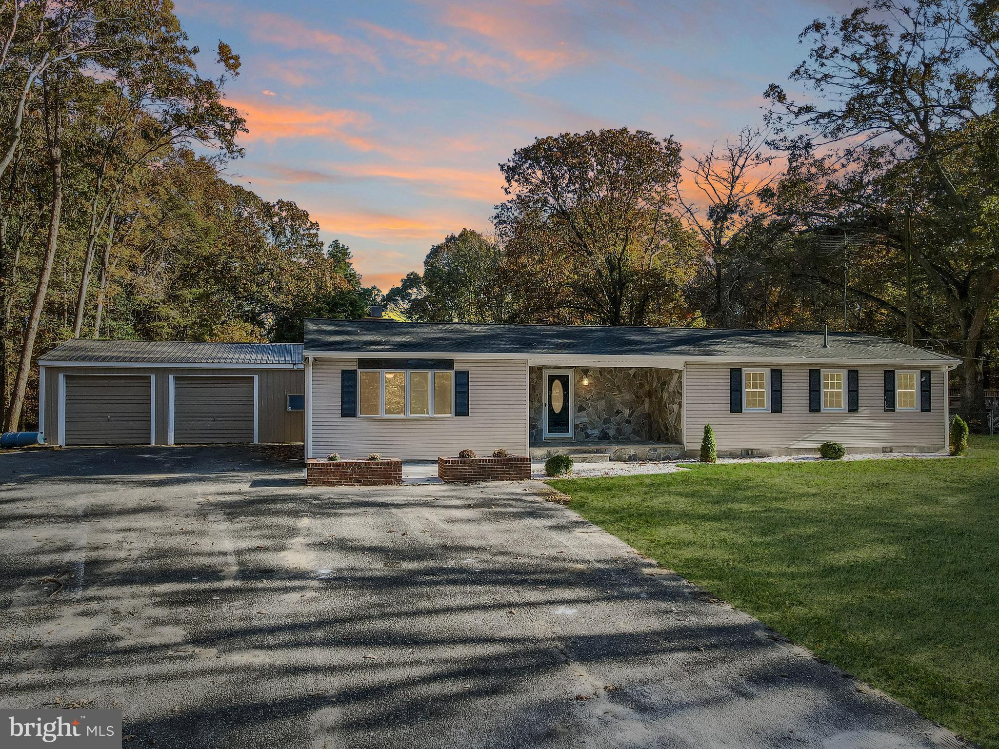 a house that has a big yard in front of it