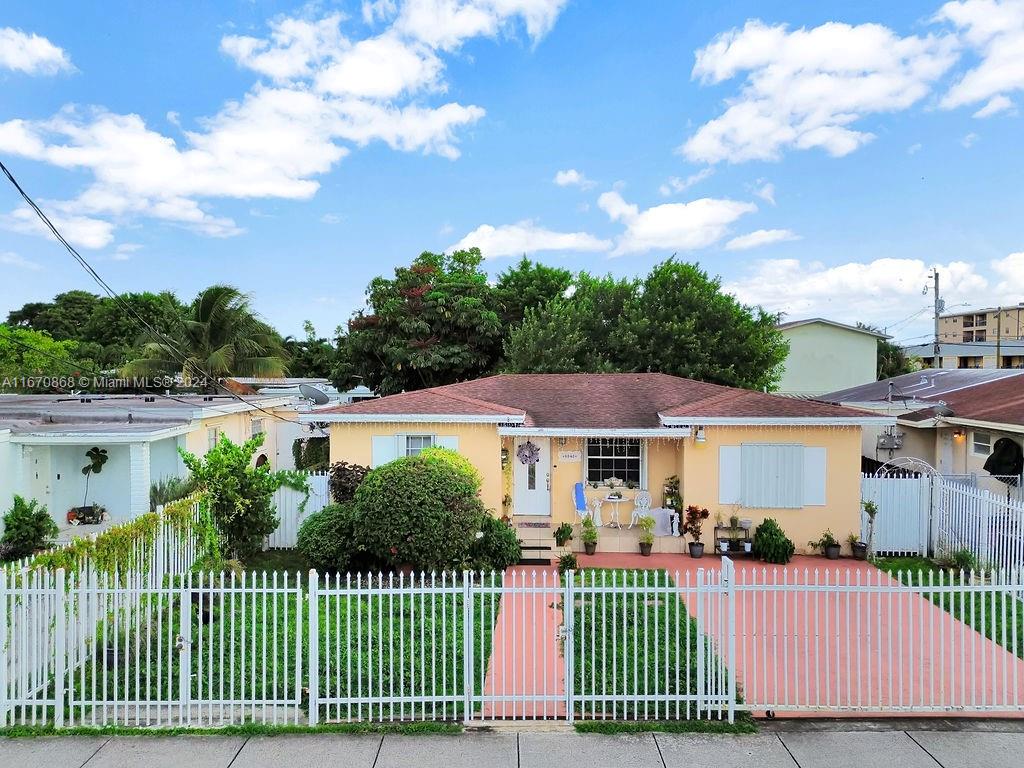 a view of a house and a yard