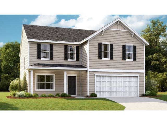 View of front of house featuring a garage and a fr