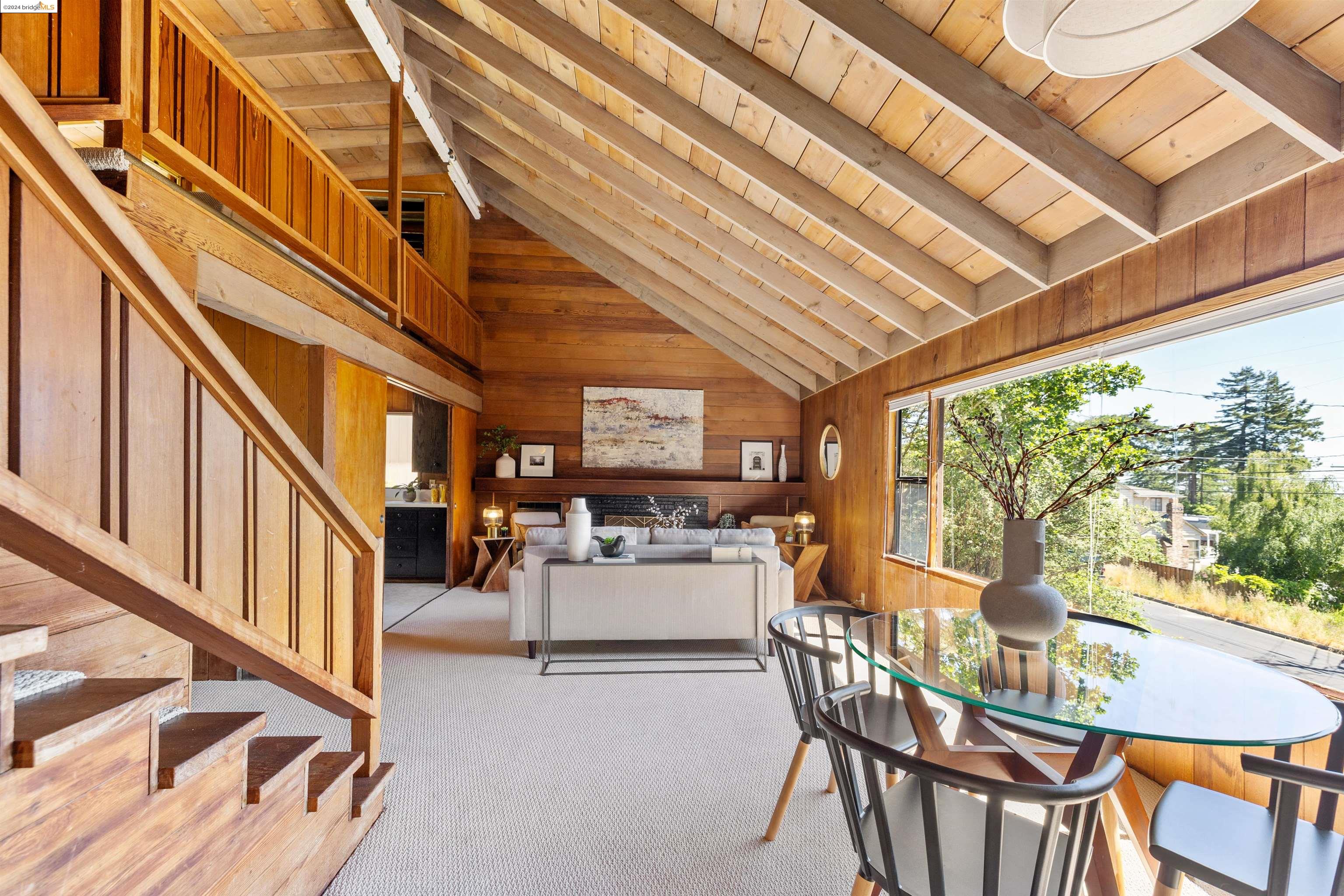 a dining room with furniture water view and balcony