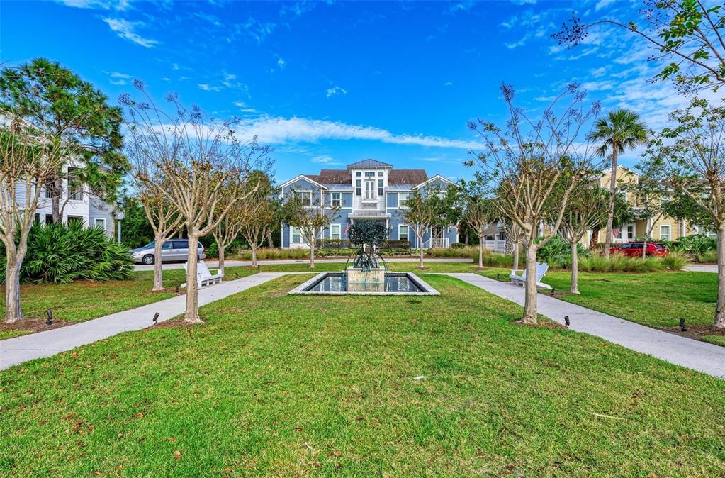 This Stunning Home has an amazing entry in front of the Mangrove Fountain Park!