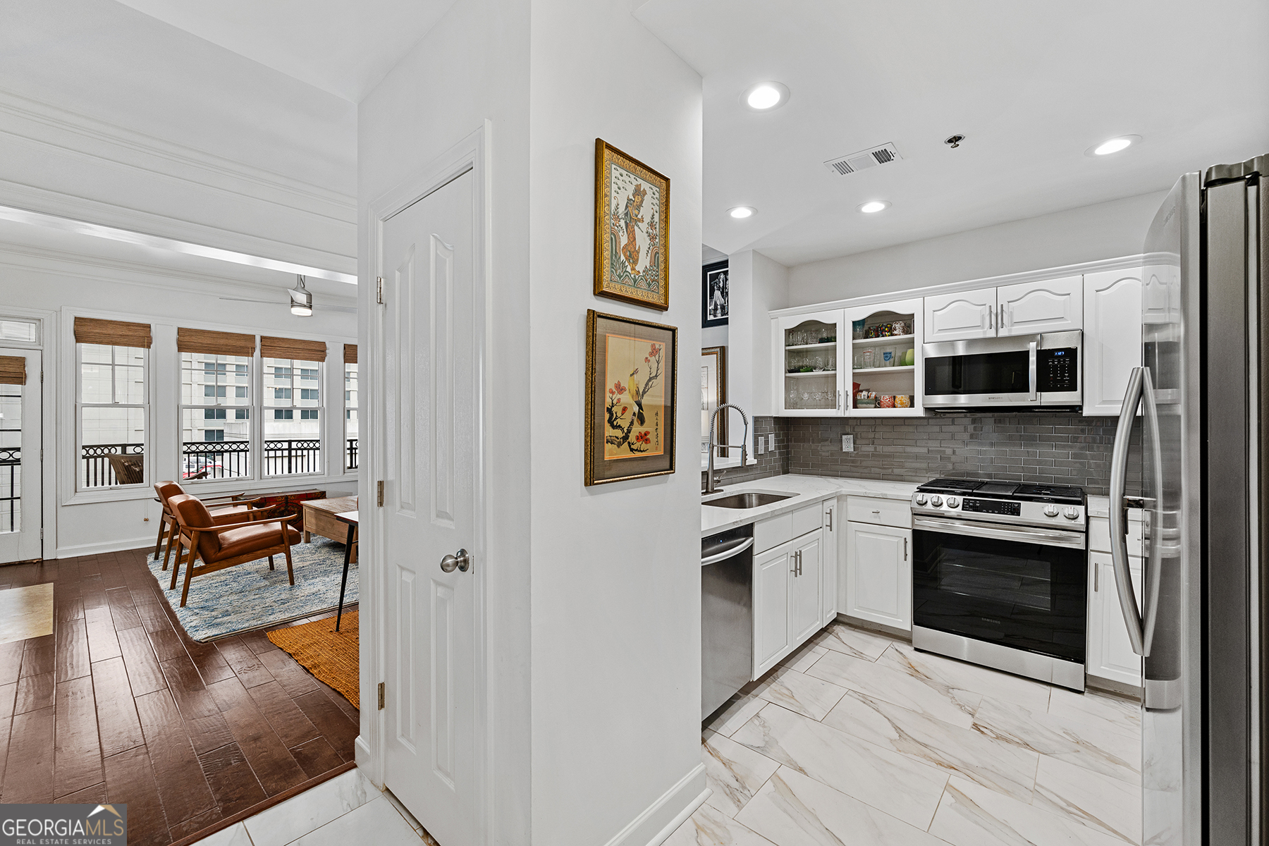 a kitchen with stainless steel appliances granite countertop a stove and a refrigerator