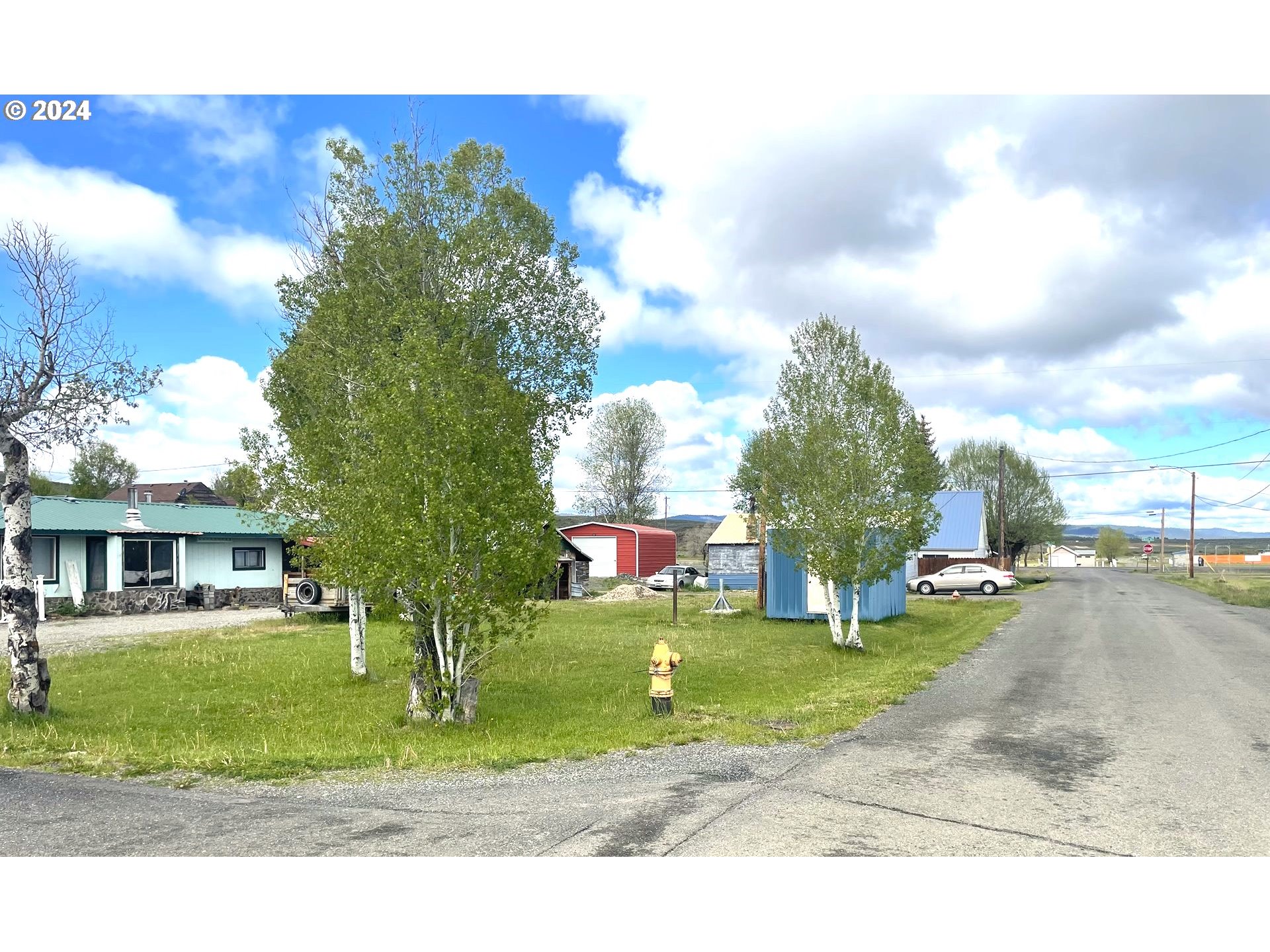 a view of a house with a big yard