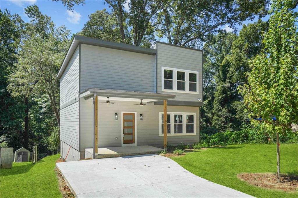 a front view of a house with garden