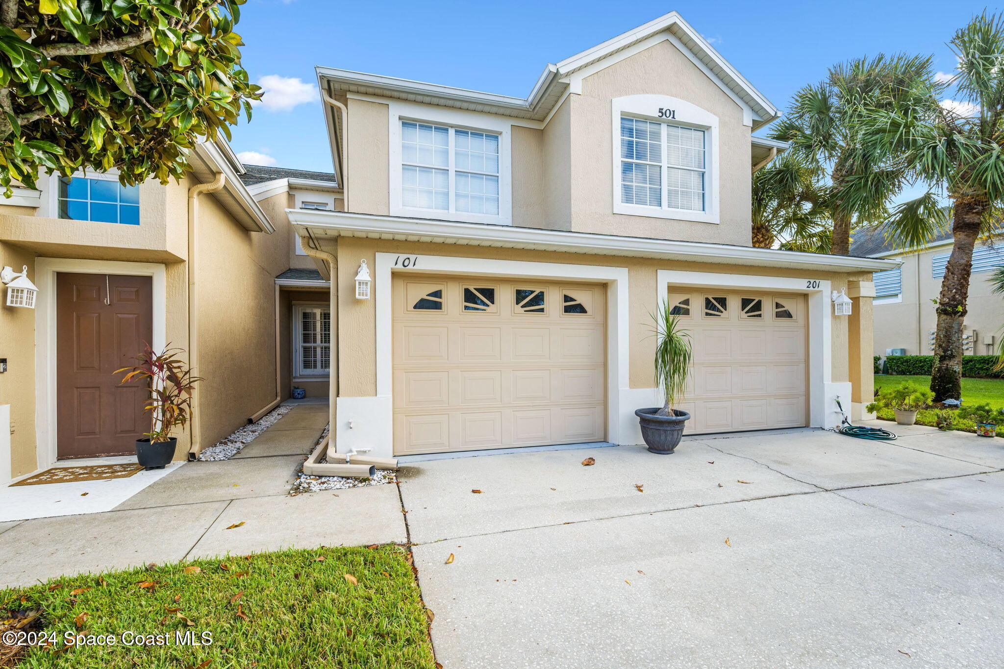 a front view of a house with a garage