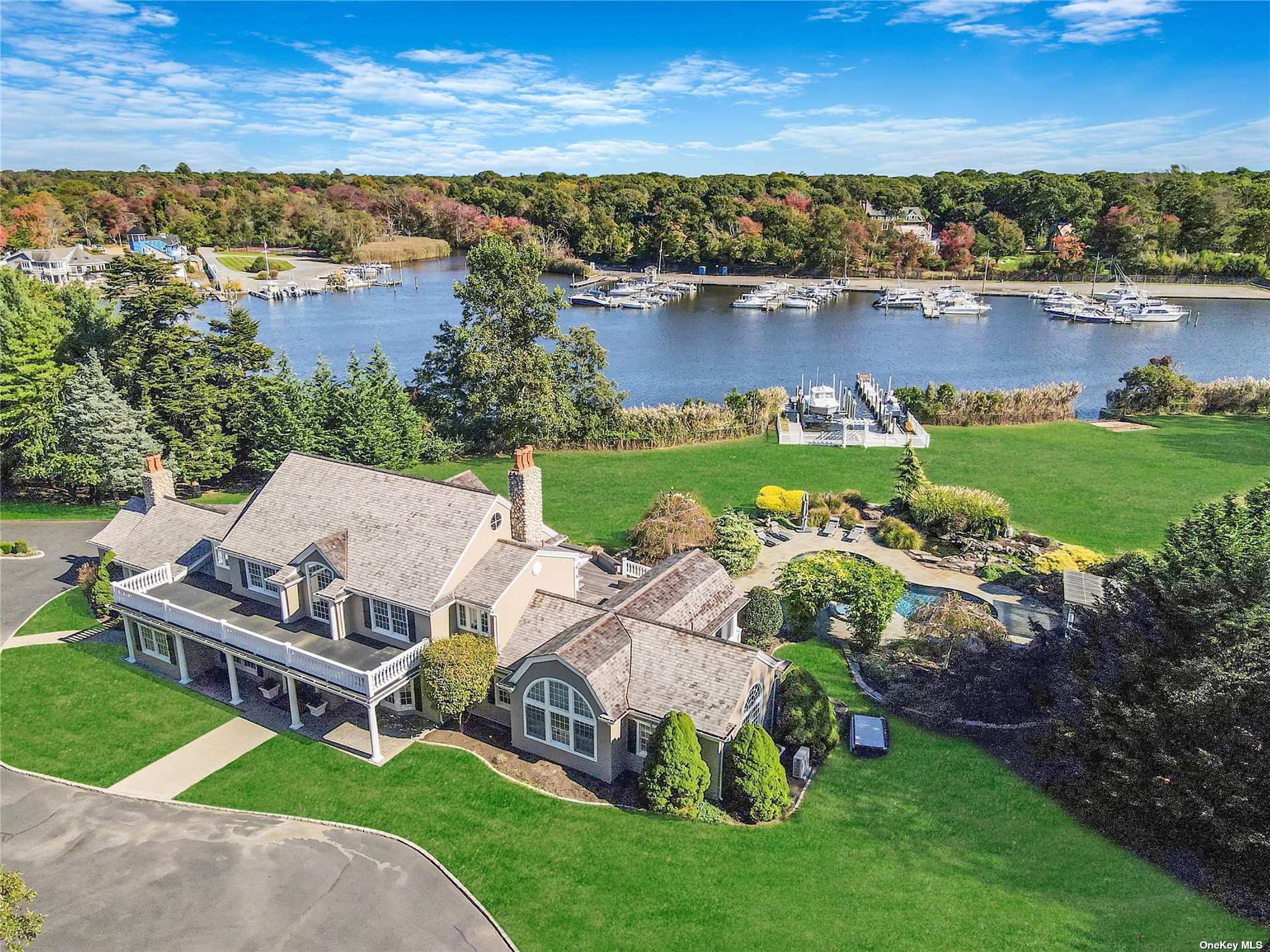 an aerial view of a house with garden space and lake view