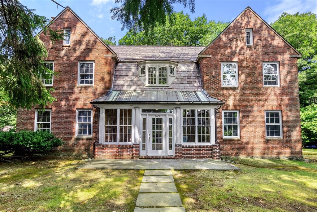 a view of a house with swimming pool and a porch