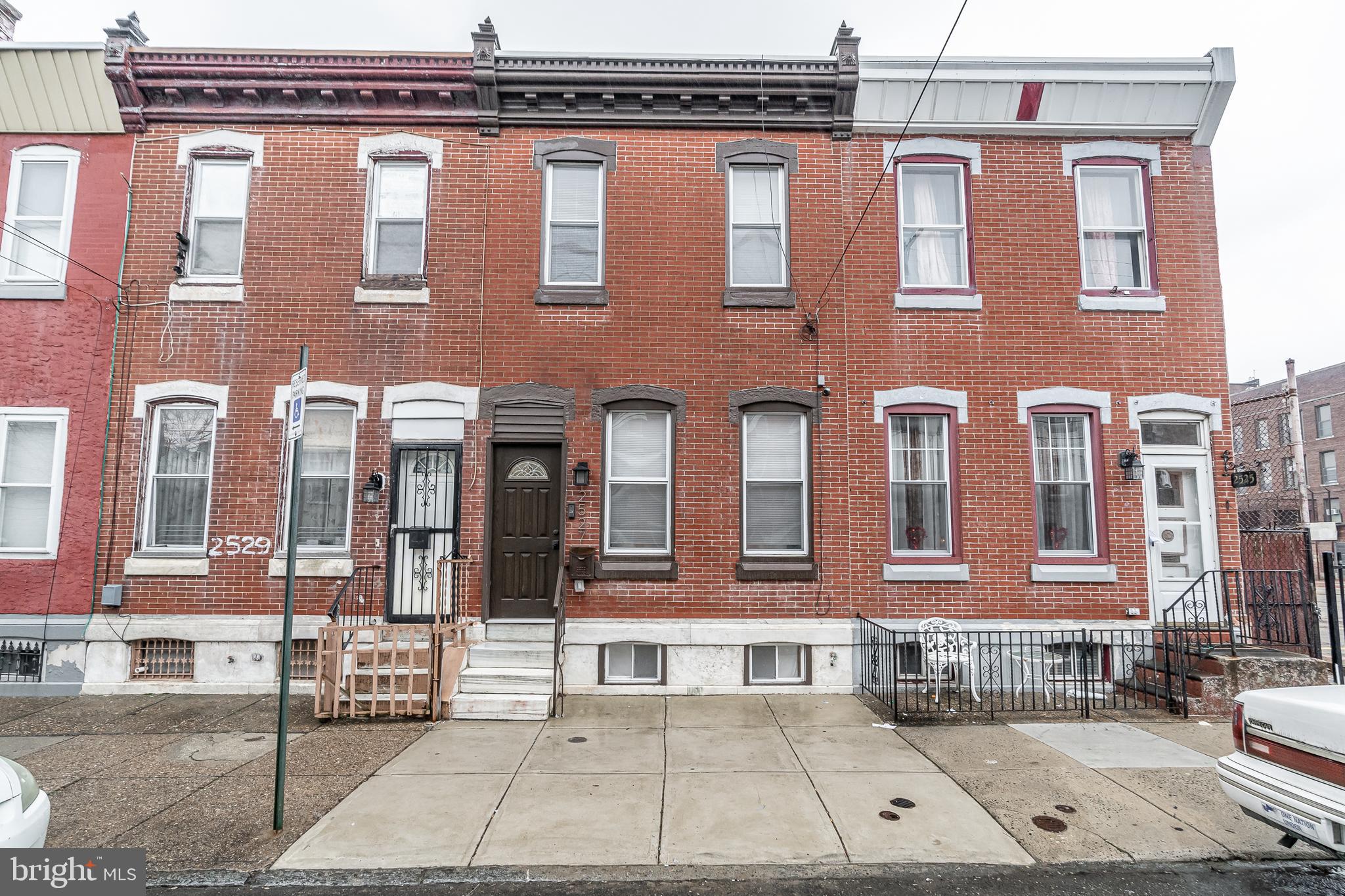 a view of a brick building with many windows