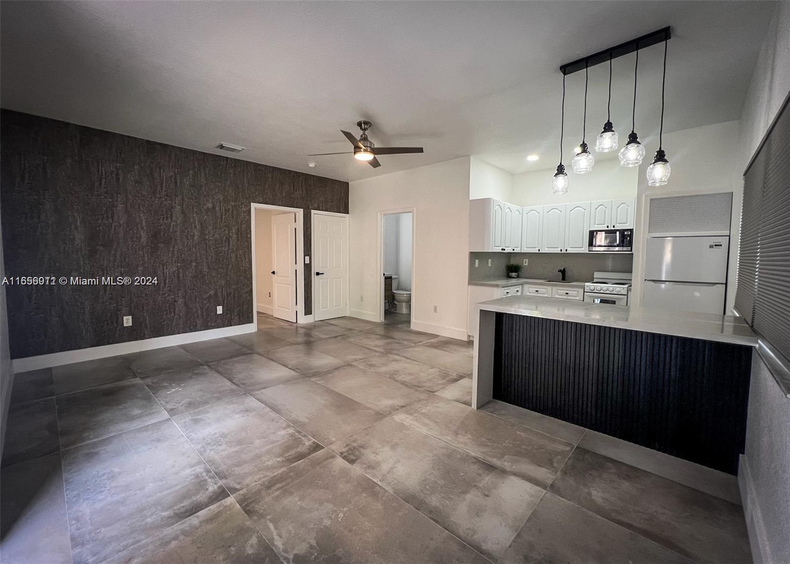 a large kitchen with cabinets