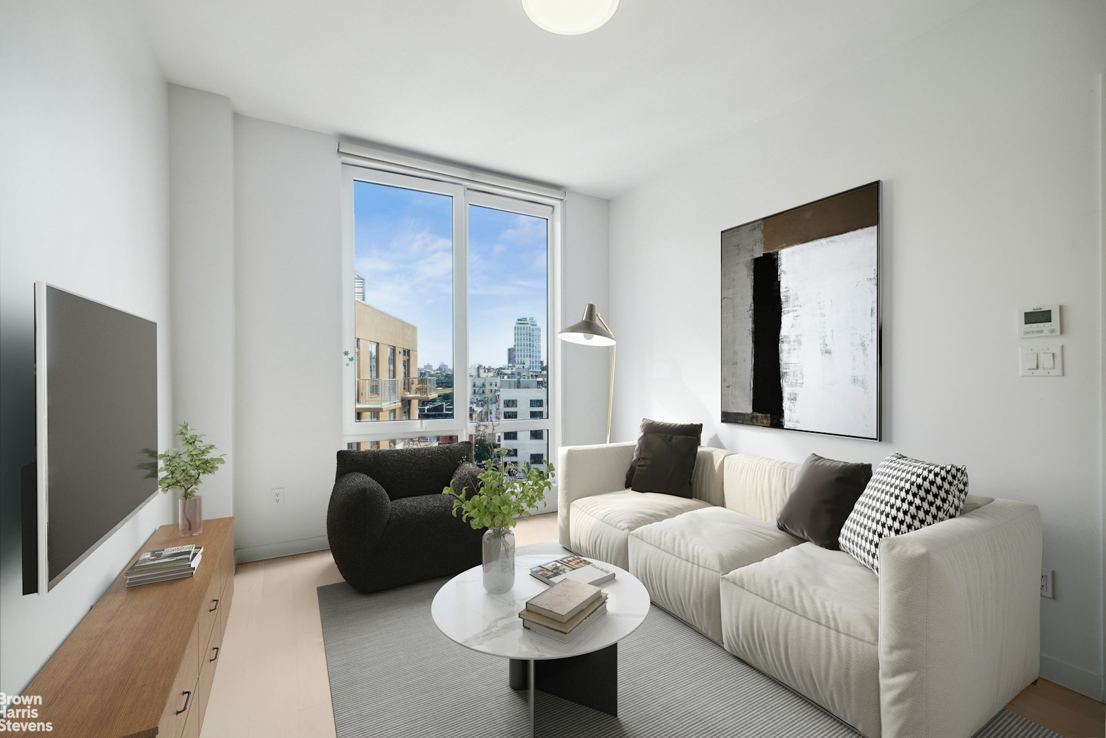 a living room with furniture and a flat screen tv