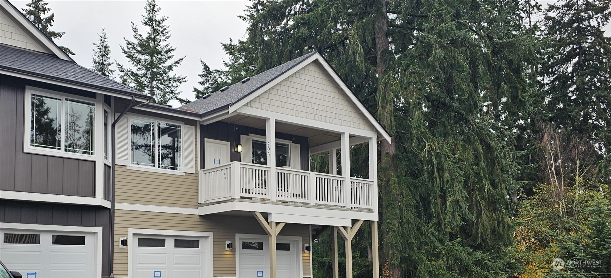 a view of a house with a yard and balcony