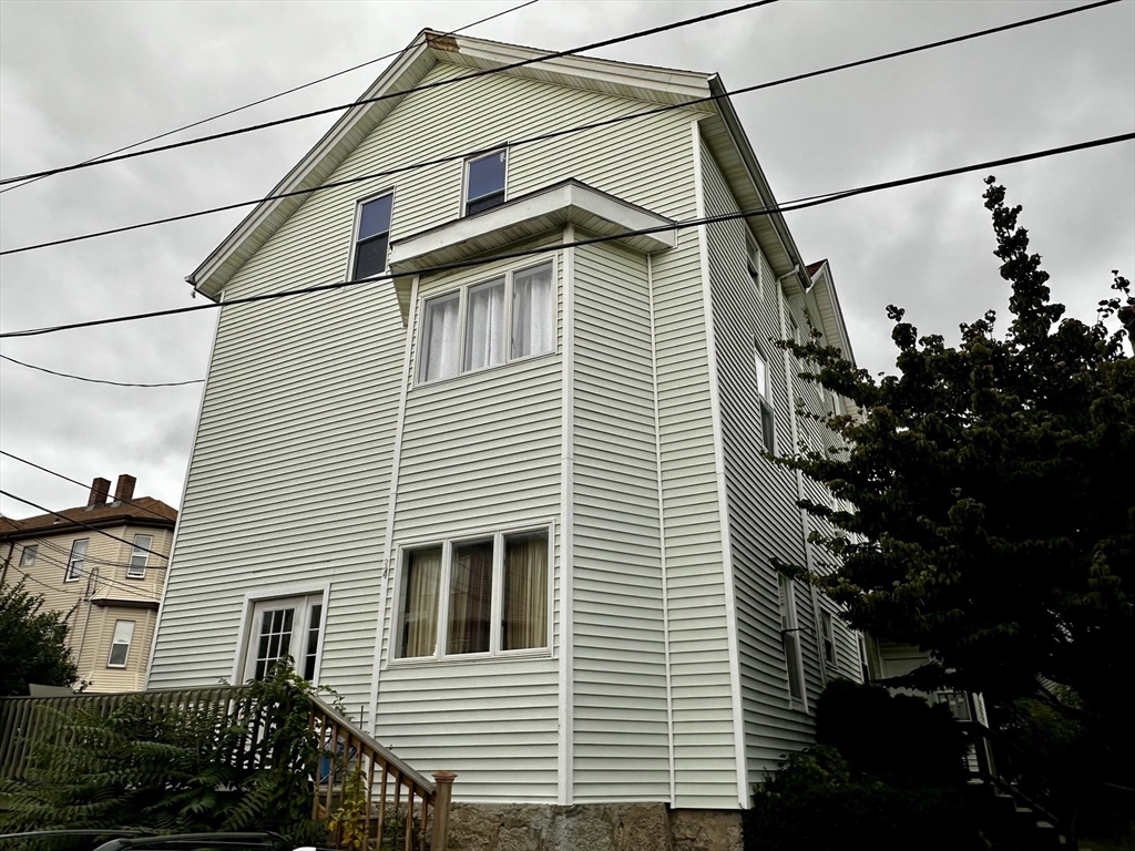 a view of a house with a street