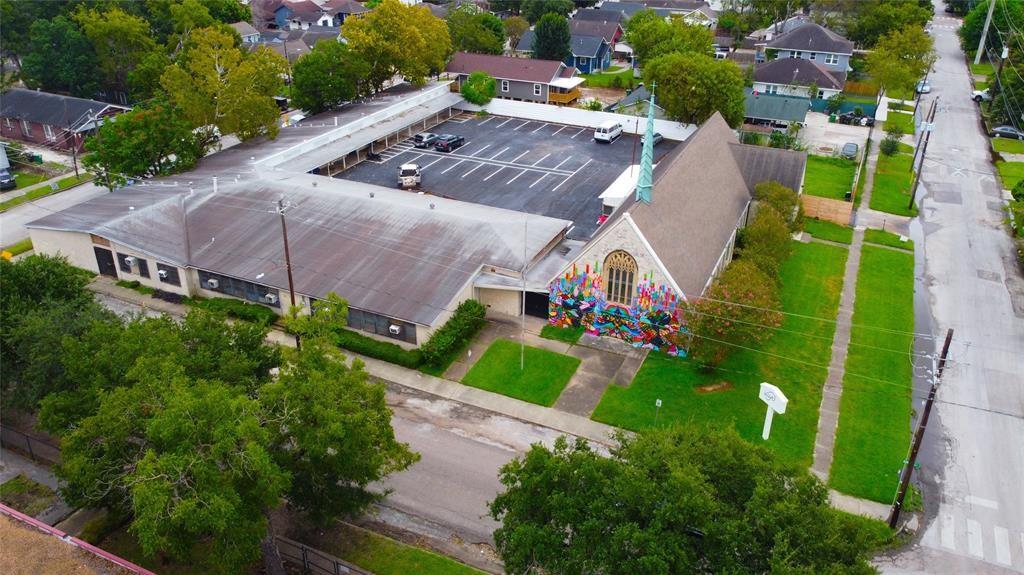 an aerial view of multiple houses with yard