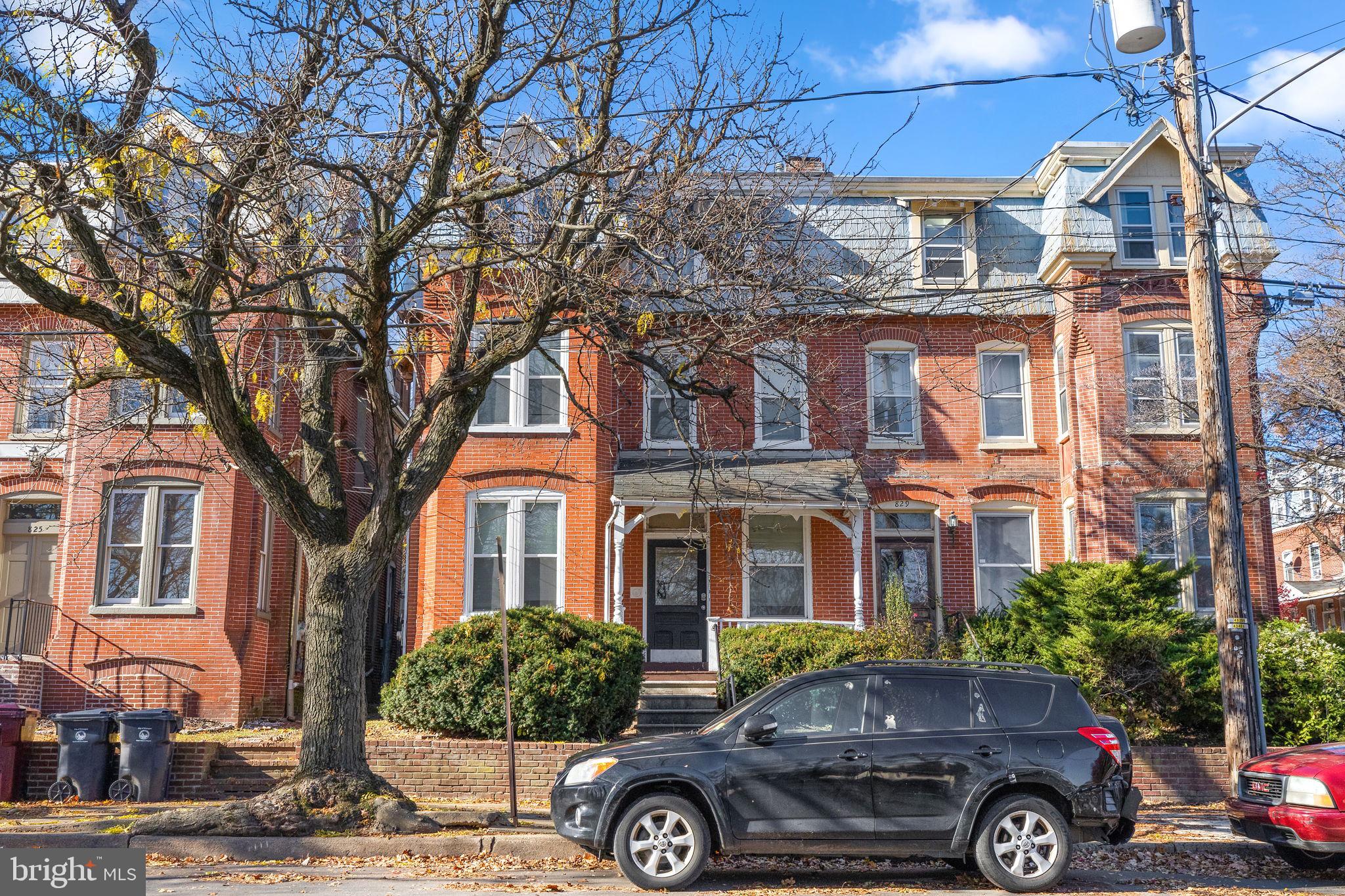 a front view of a house with parking space