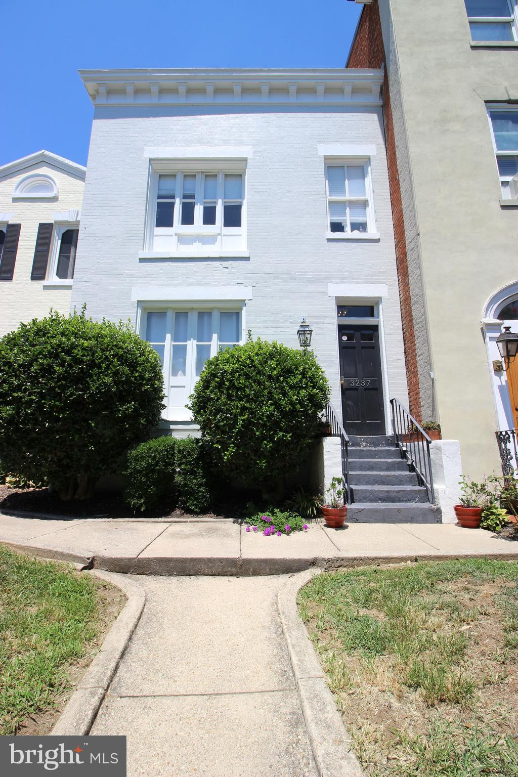 a view of house with yard