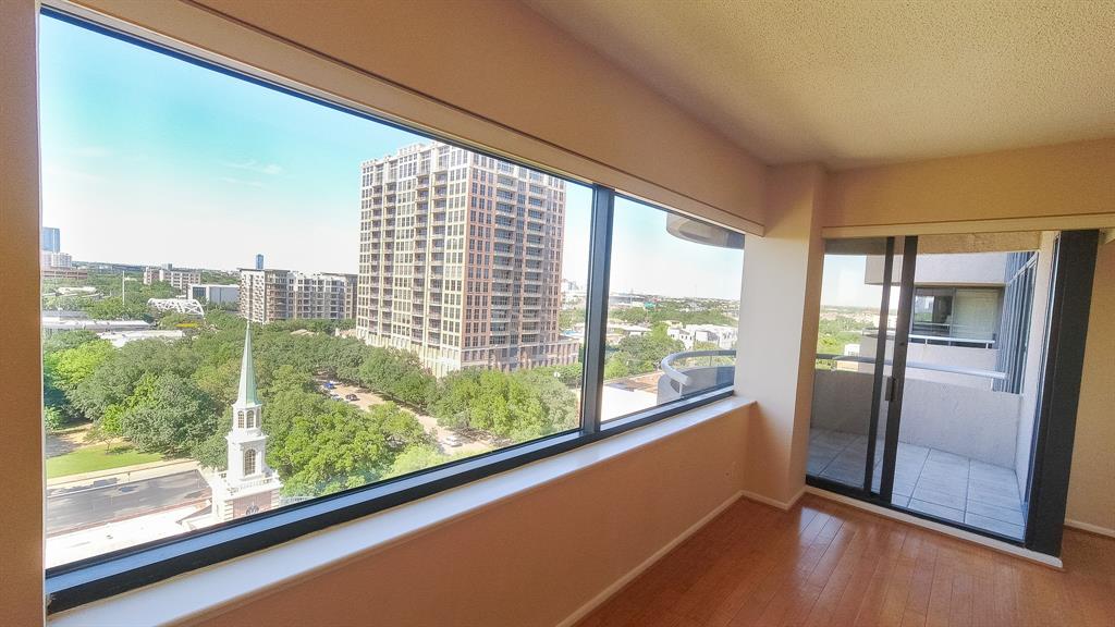 Living room with a balcony and great view of the city