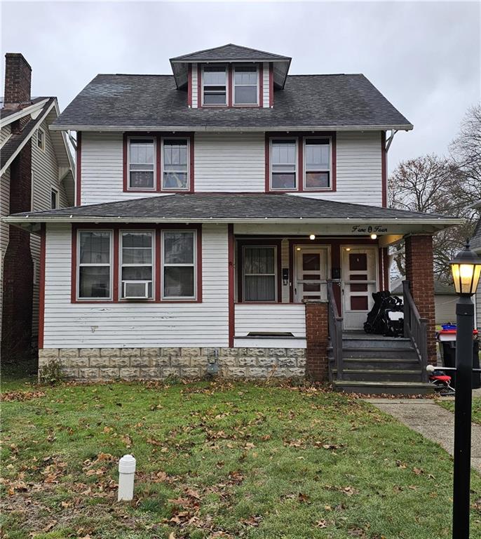 front view of a house with a yard