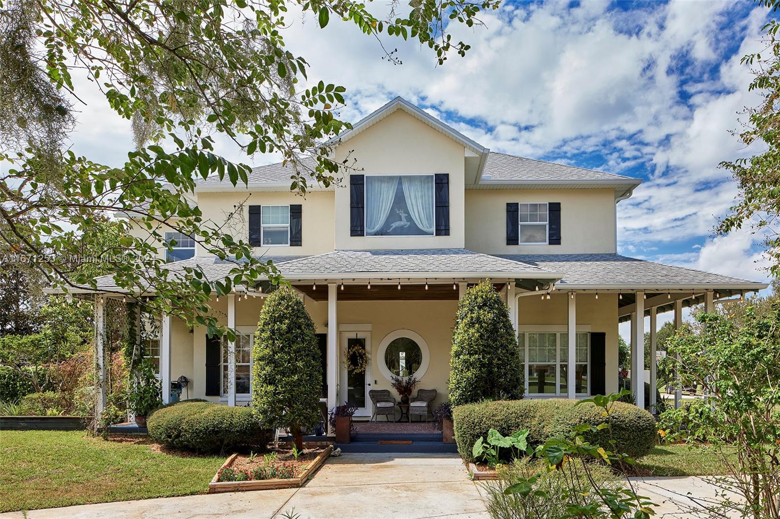 a front view of a house with garden