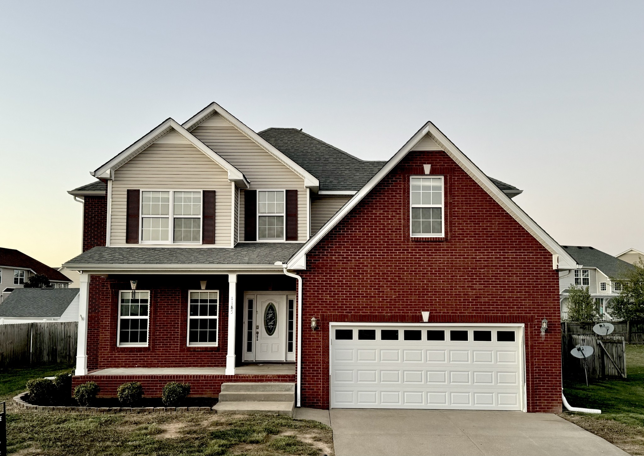 a front view of a house with a garage