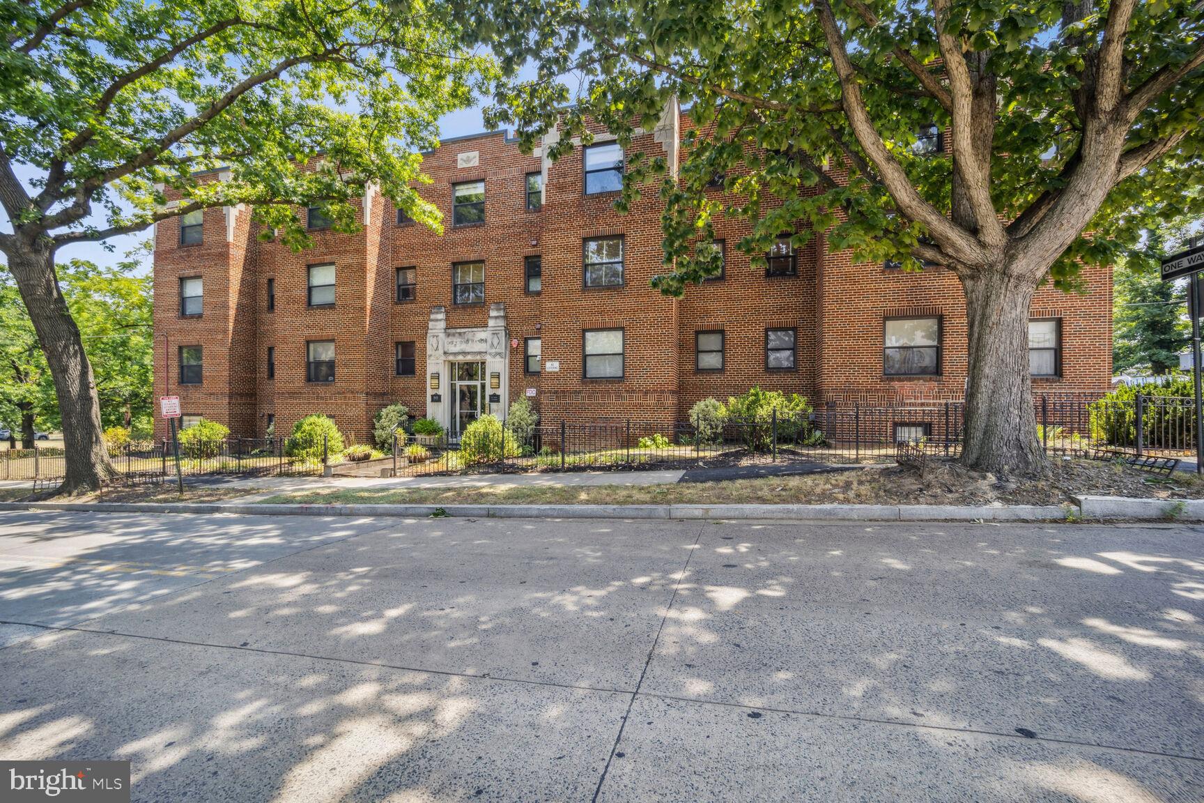 a front view of a building with street view