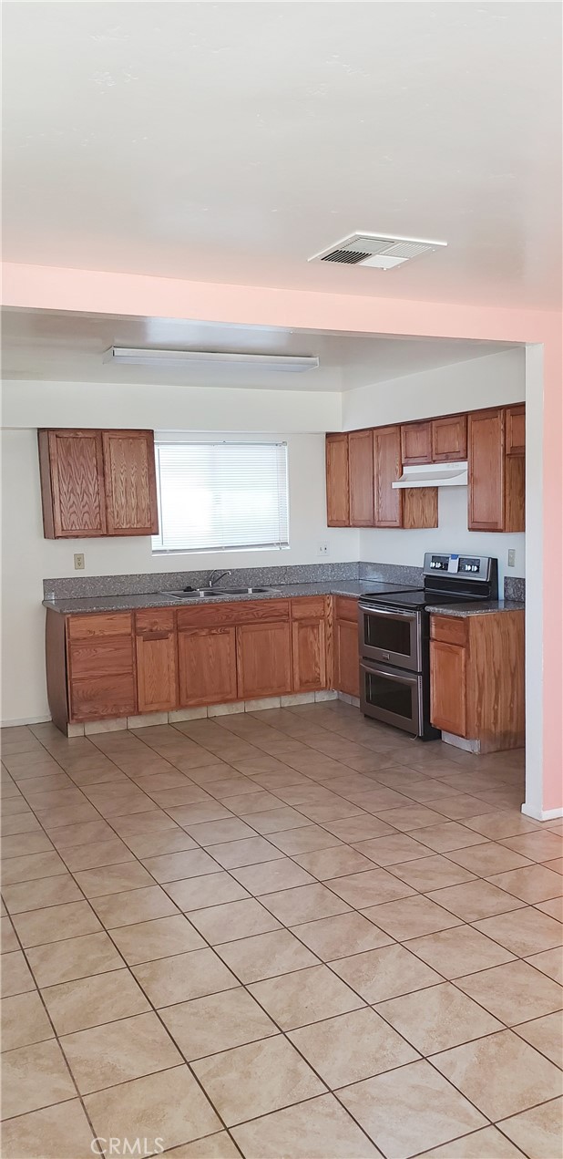 a view of a kitchen with microwave and cabinets