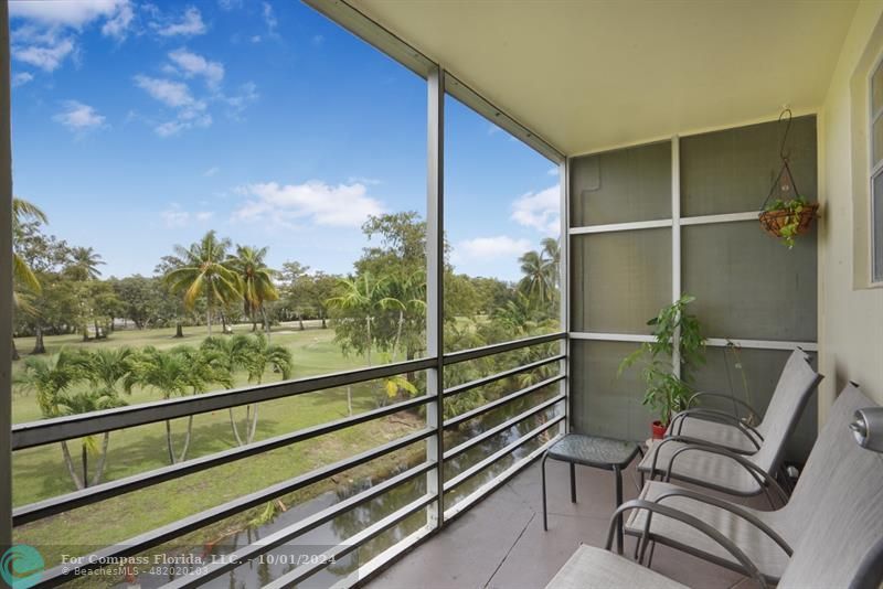 a view of a balcony with chairs