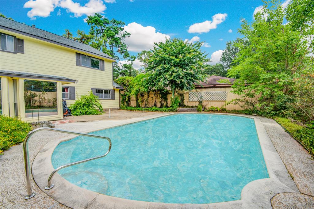 Alternate view of the pool looking towards the Sunroom and back of the Home.