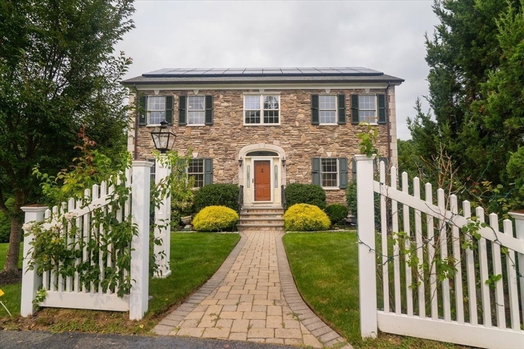 a front view of a house with garden