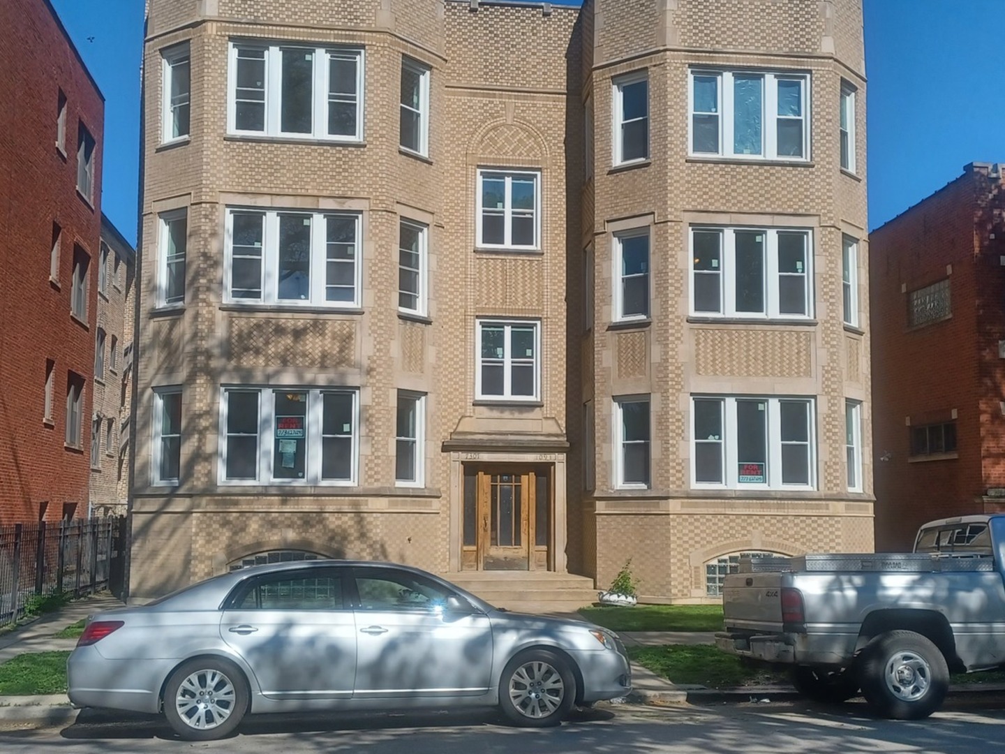 a front view of a house with parking space