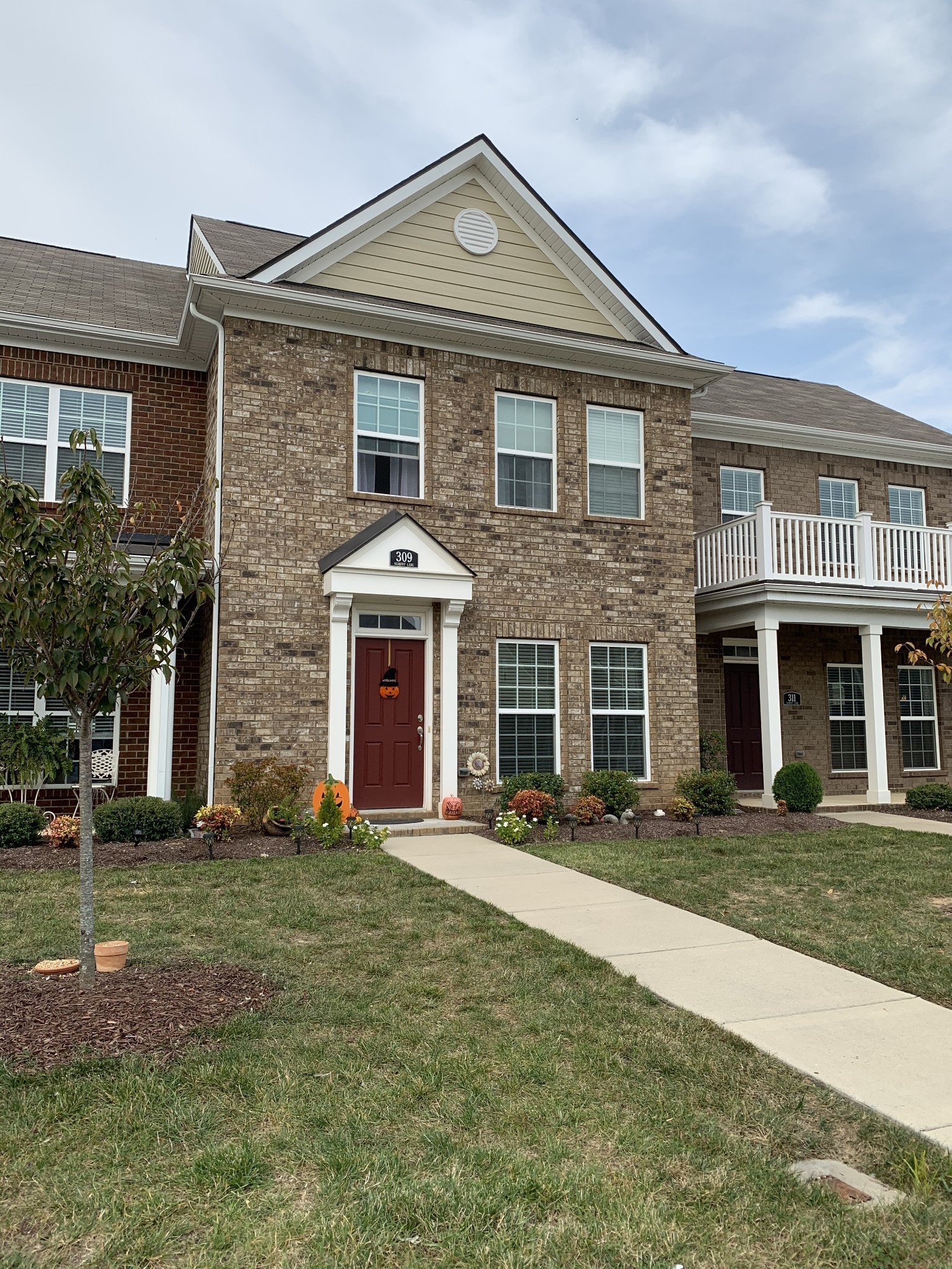 a front view of a house with a yard