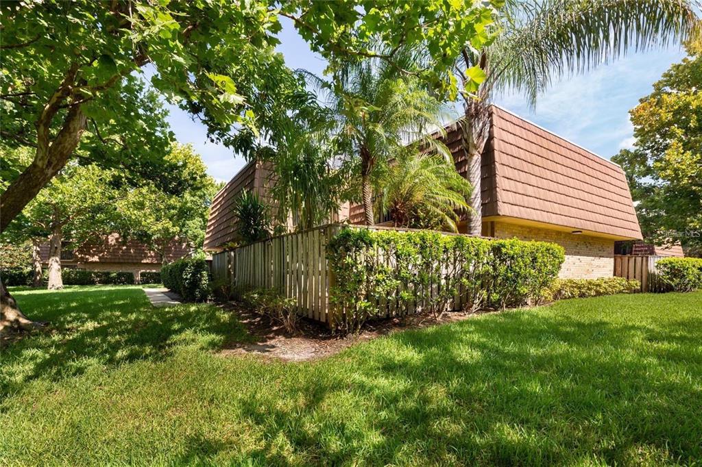 a backyard of a house with lots of green space