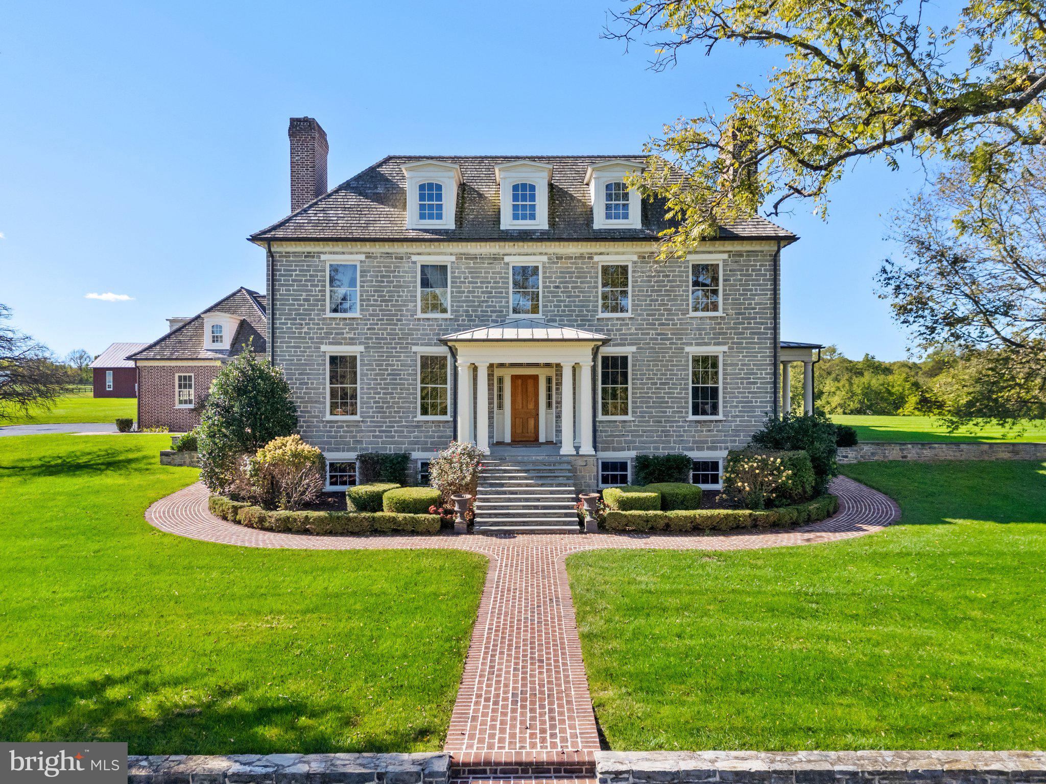 a front view of house with yard and green space