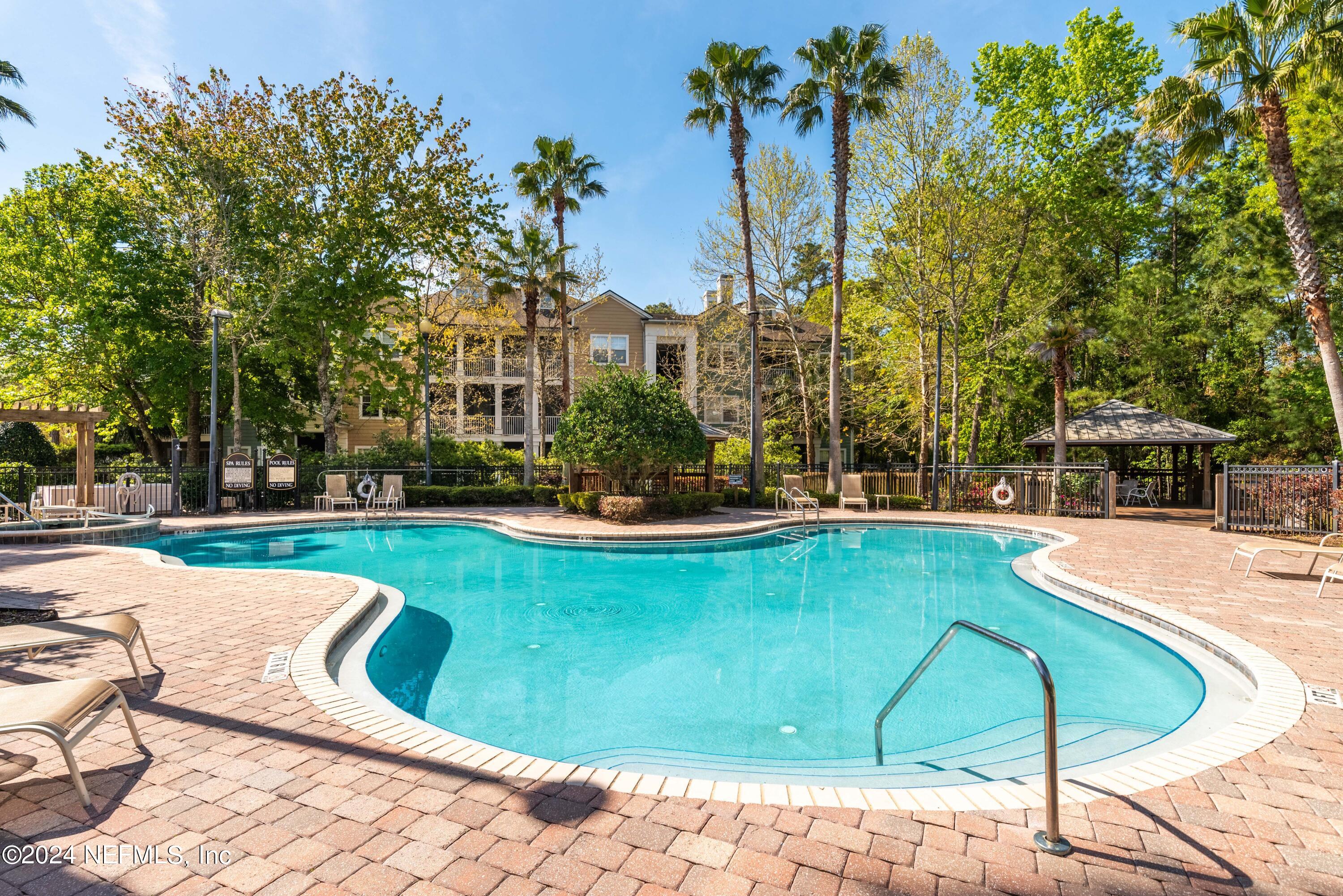 a view of a swimming pool with a patio