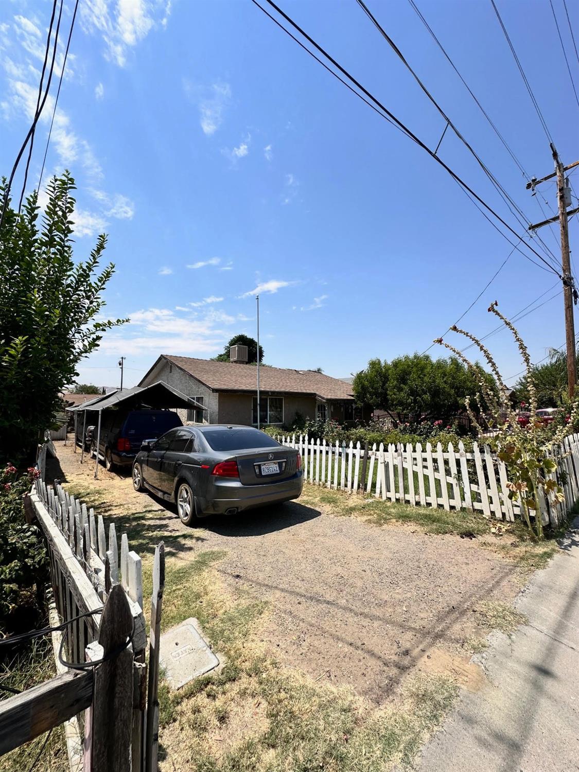 a view of balcony with a car parked on the road