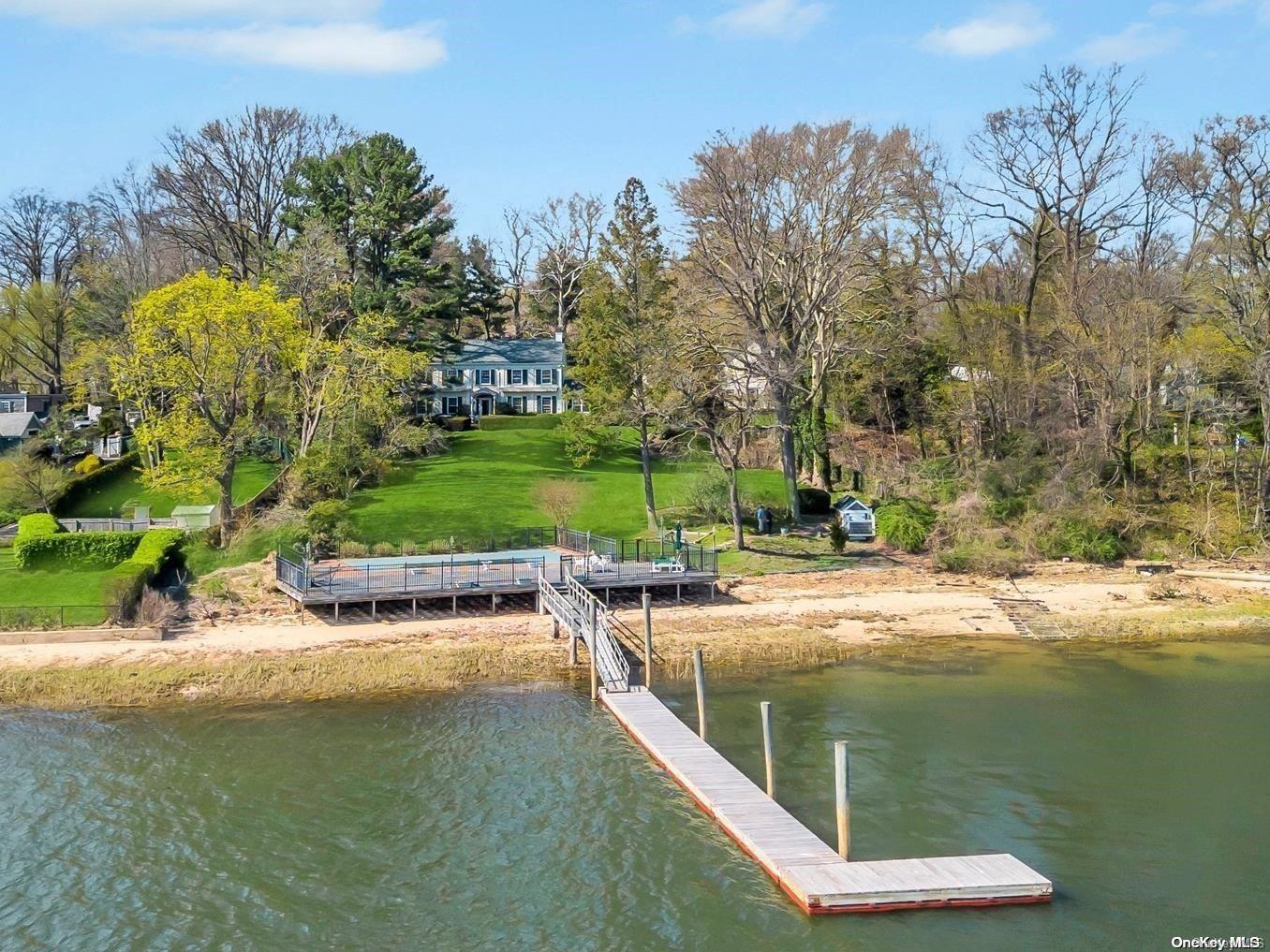 a view of a lake with a house in the background