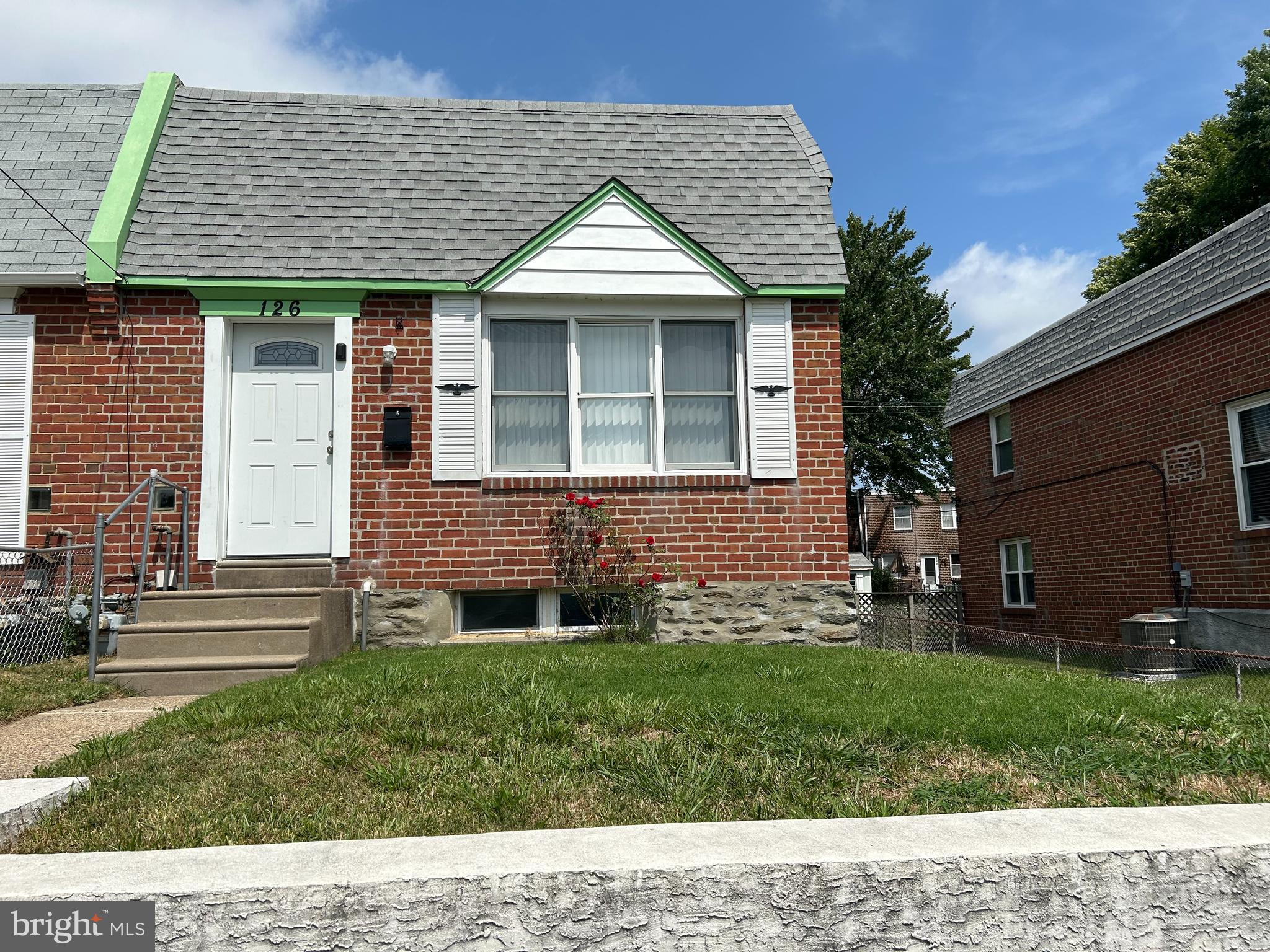 front view of a house with a yard