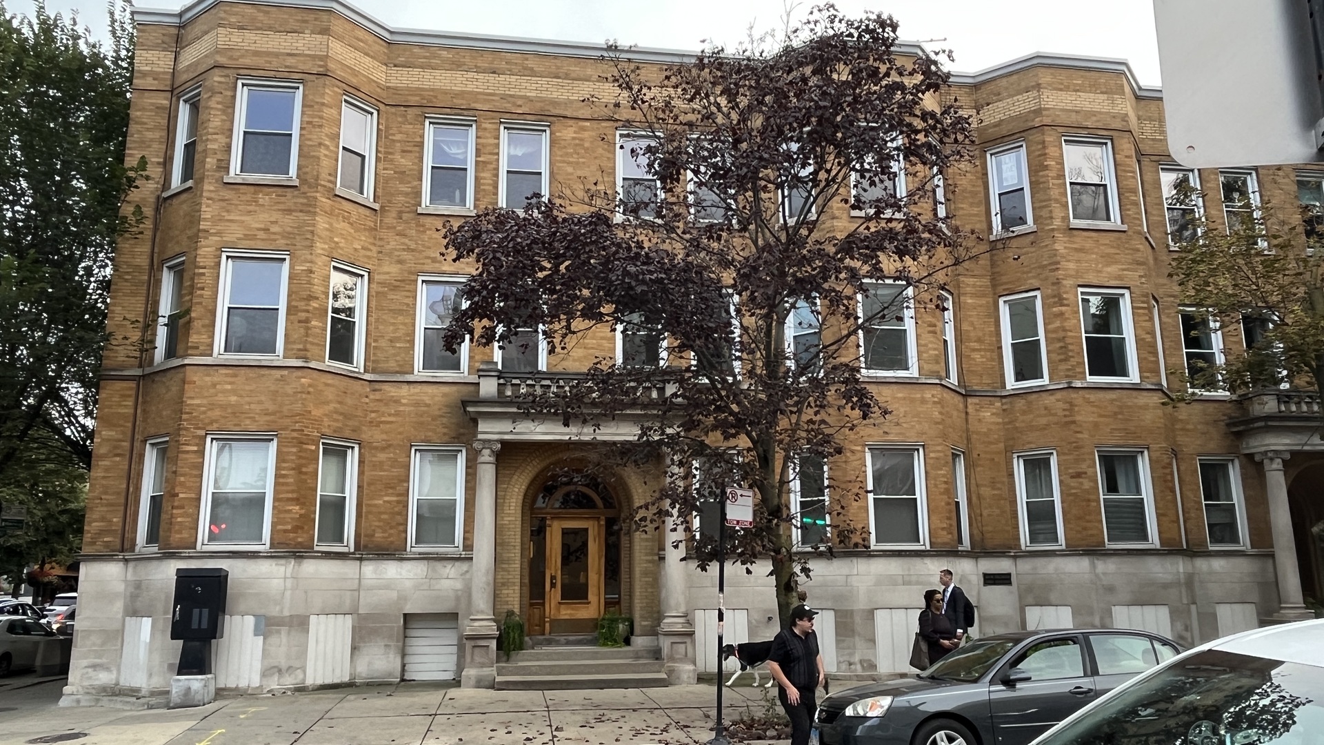 a front view of a building with many windows