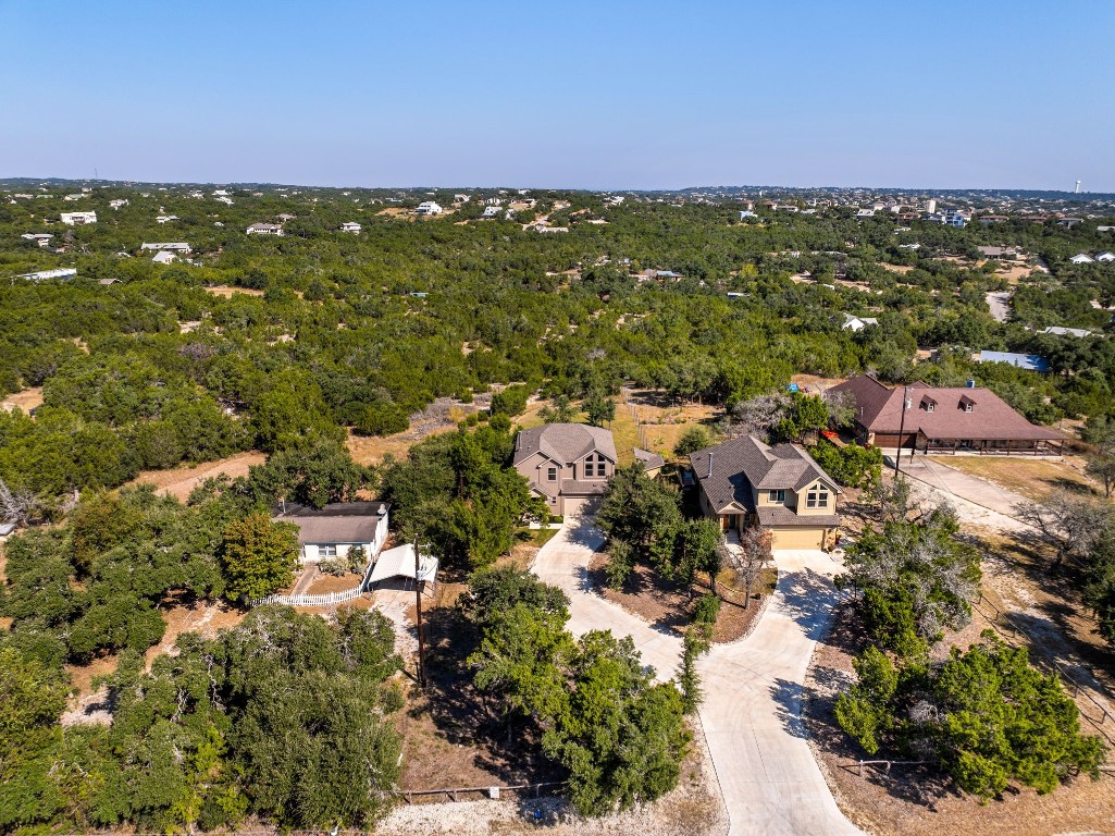 an aerial view of residential houses with city view