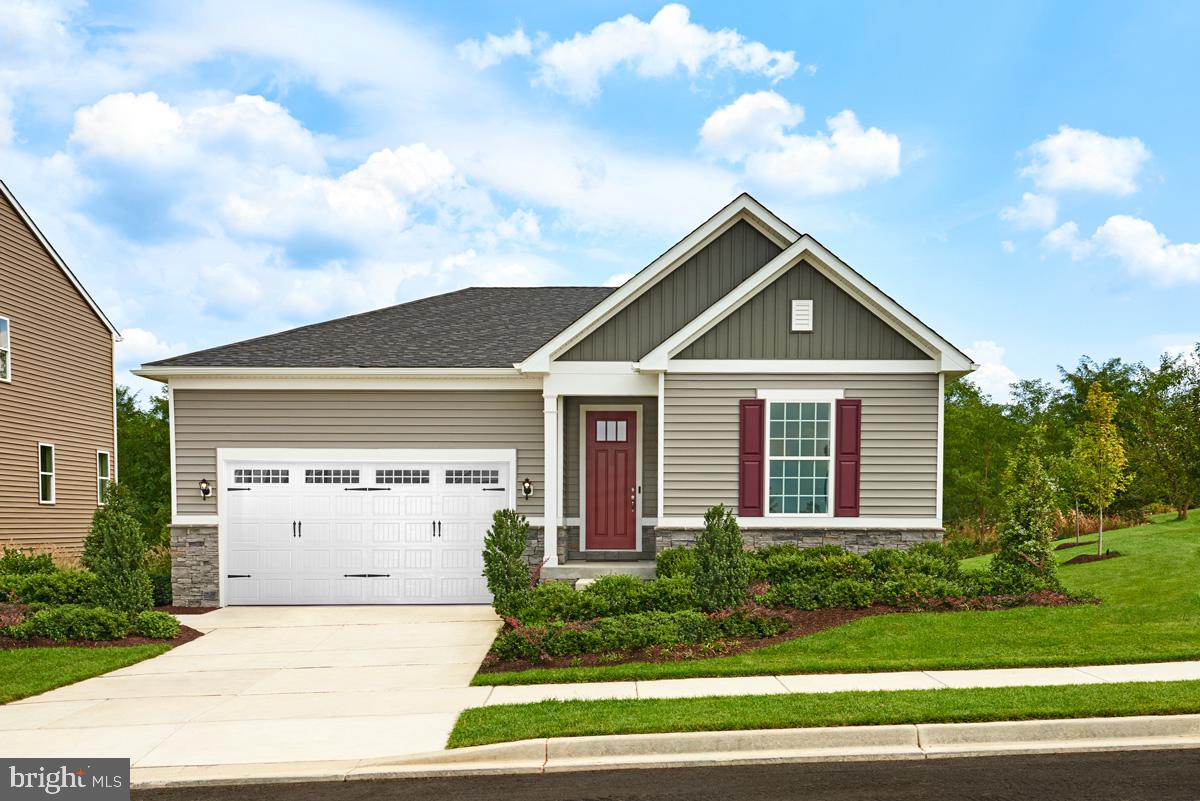 a front view of a house with garage