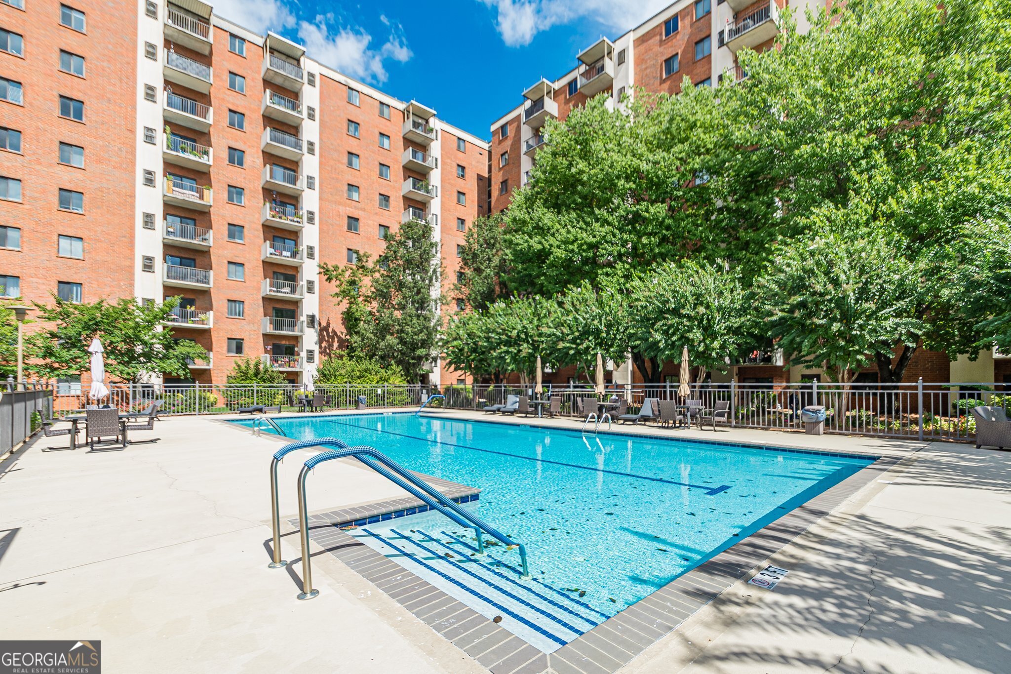 a view of a swimming pool with a patio