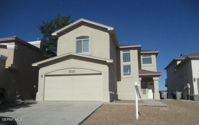 a front view of a house with a garage