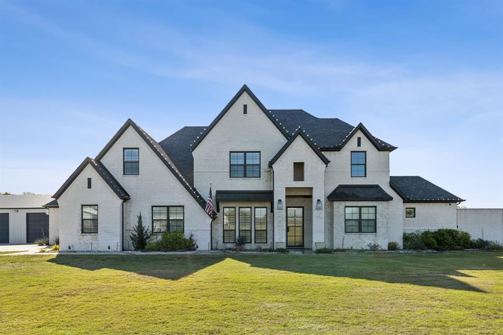 a front view of a house with a yard