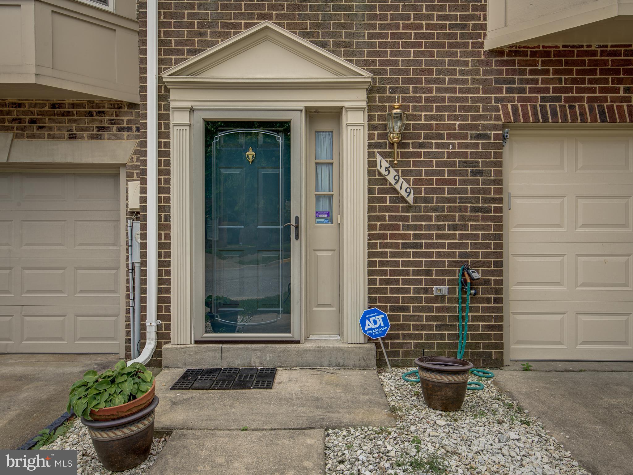 a front view of a house with pots