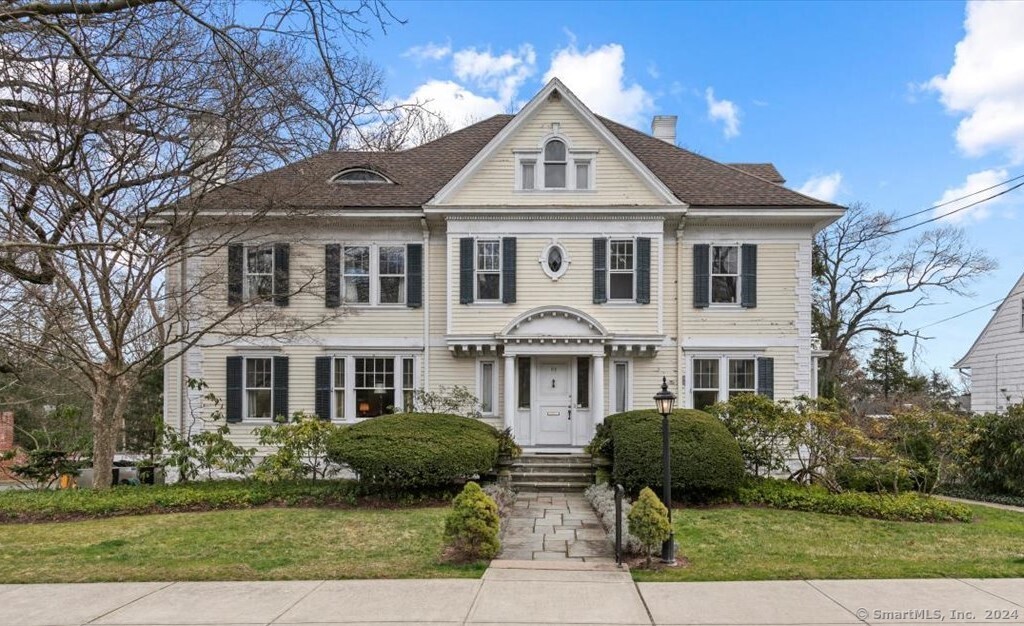 a front view of a house with a yard